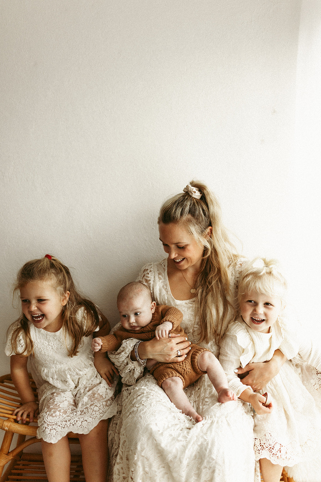 smiling mum with 3 children