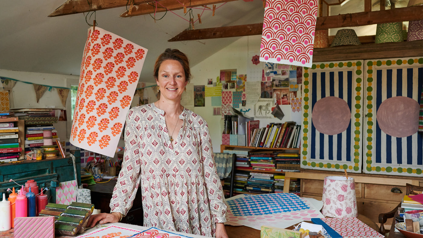 Designer Molly Mahon in her studio talking about block printing on fabrics 