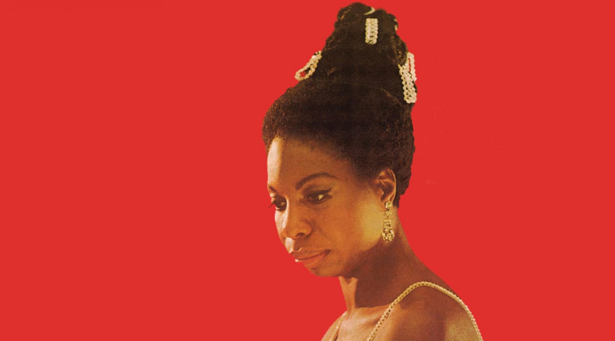 Nina Simone on a red background, the inspiration behind NINA.