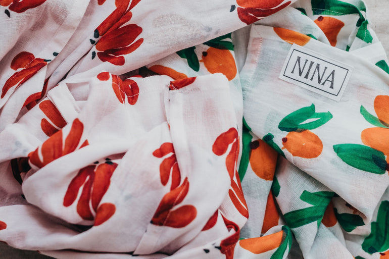 Colourful nature print on organic cotton muslins, designed by artist Kirsty Fenton
